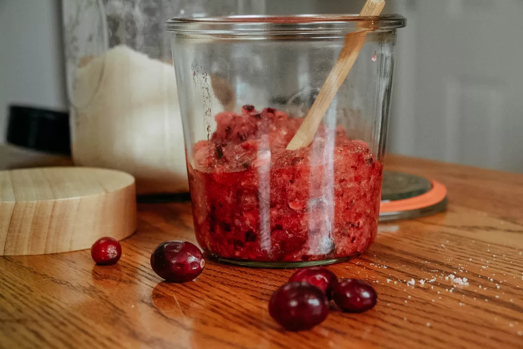 cranberry sugar scrub in glass jar