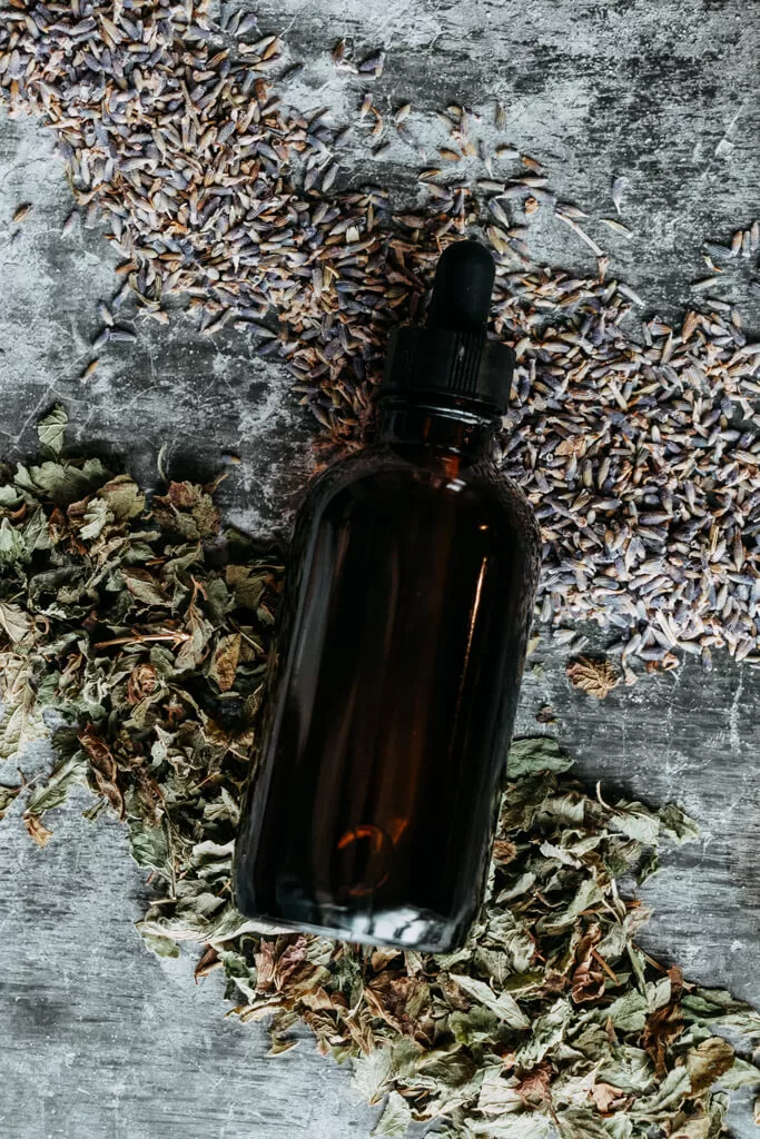 bottle on a lemon balm and lavender body oil