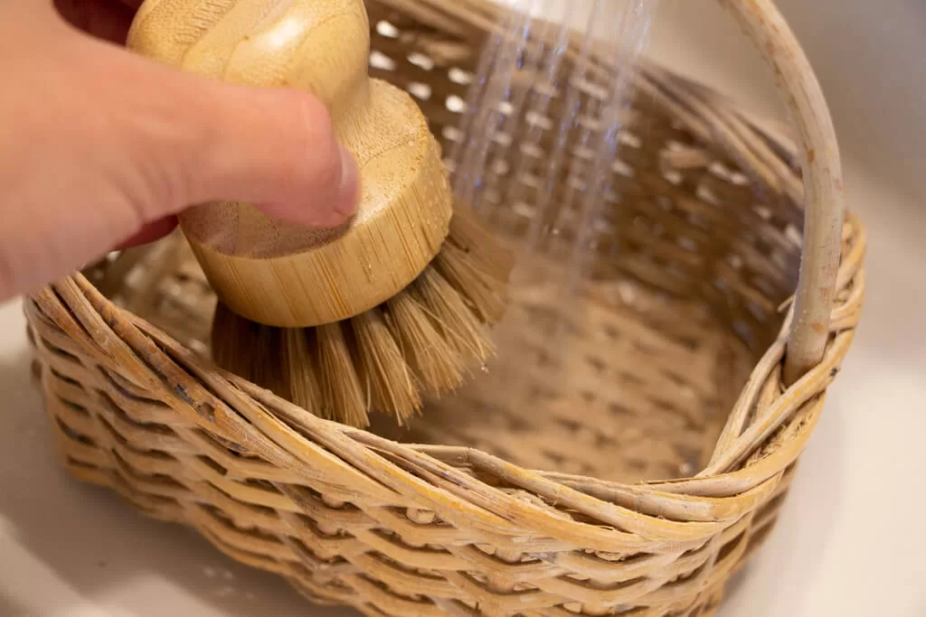 washing wicker basket in sink