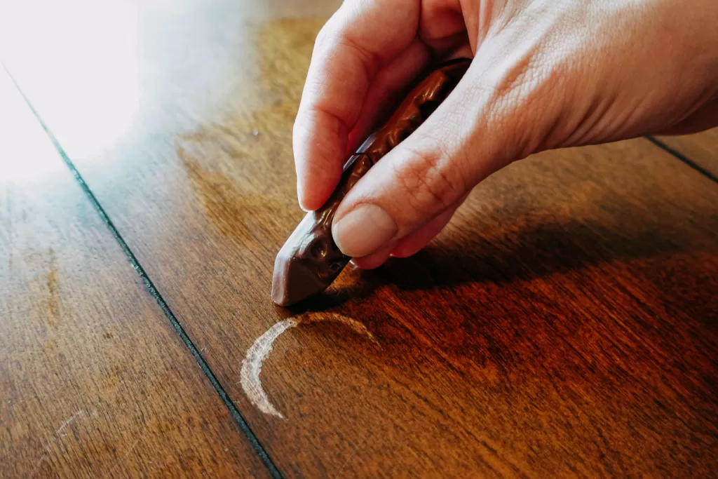 coloring in wood scratch with brown crayon
