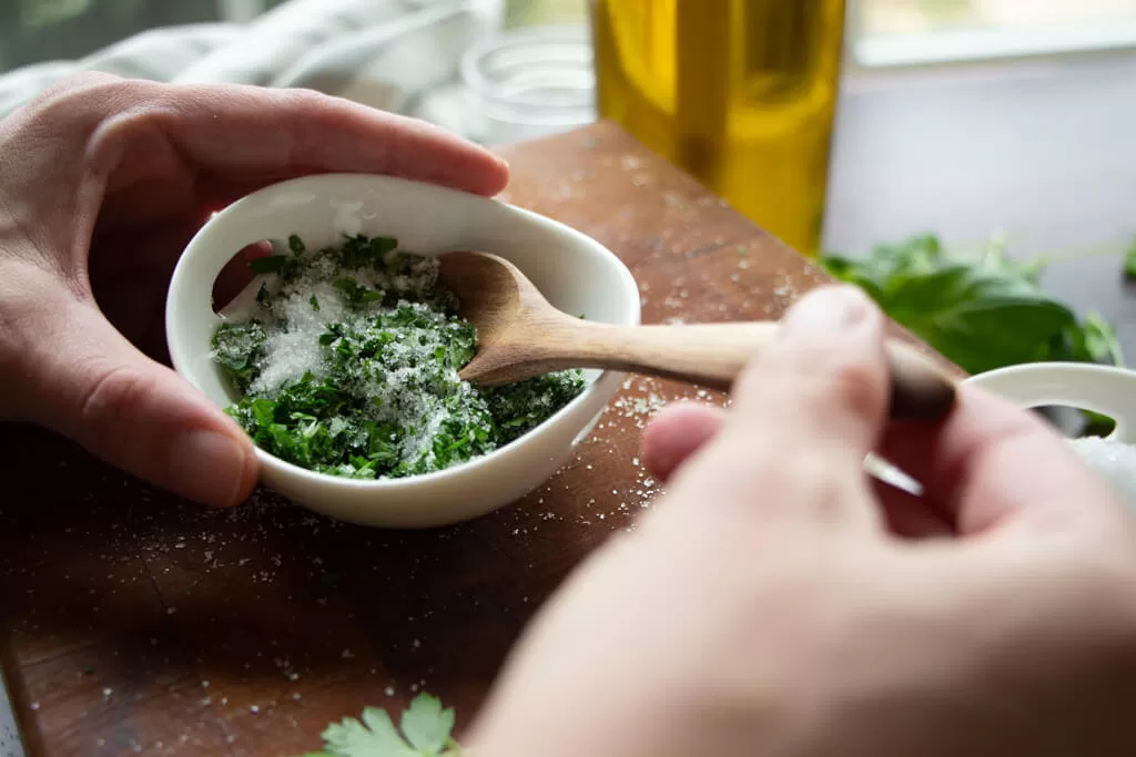 mixing herbs into salt
