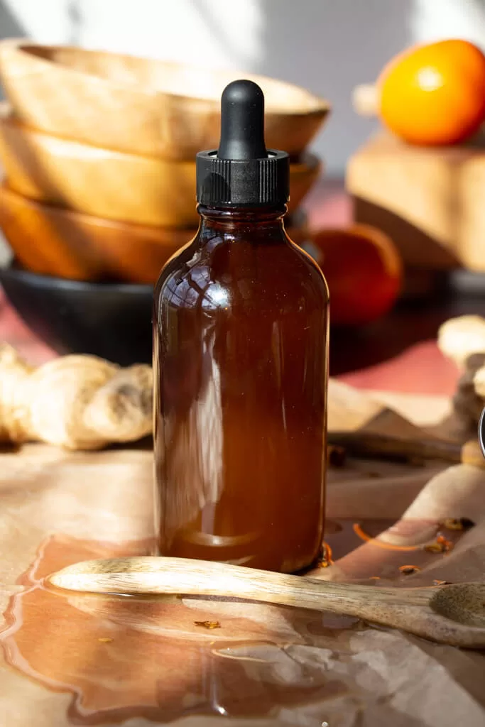herbal bitters in amber dropper bottle