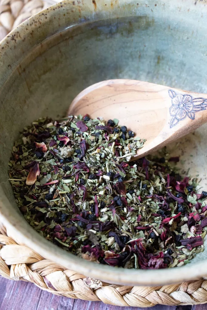 mixing herbs in bowl