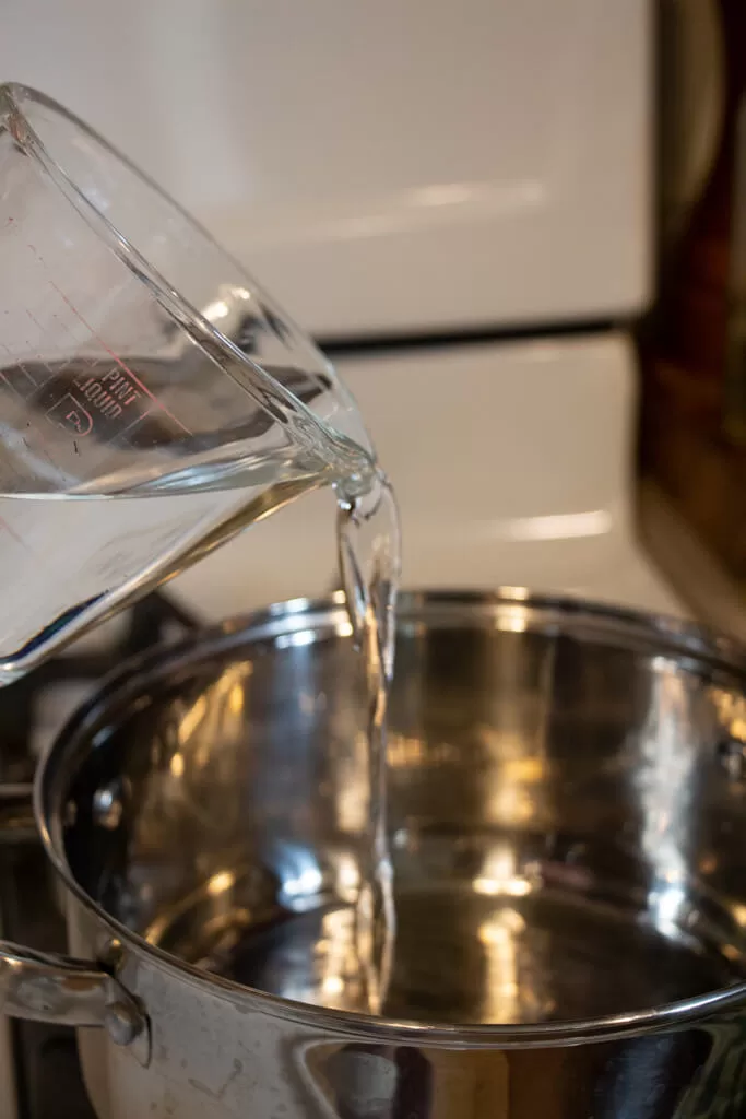 pouring water into pot
