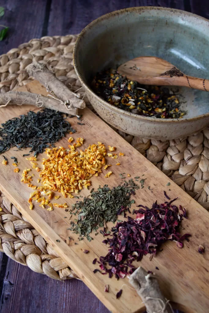 herbal anxiety tea ingredients laid out on a wood board
