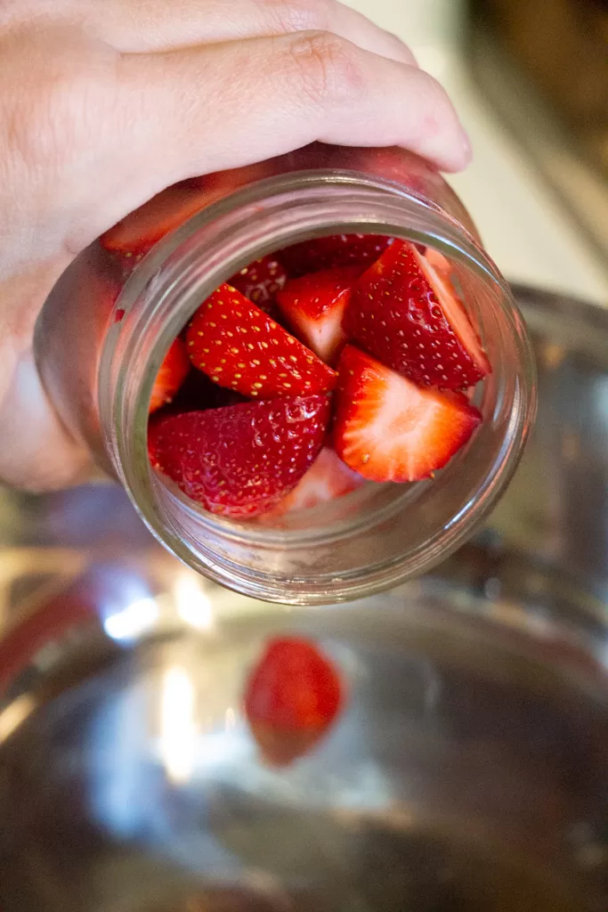 adding strawberries to pot