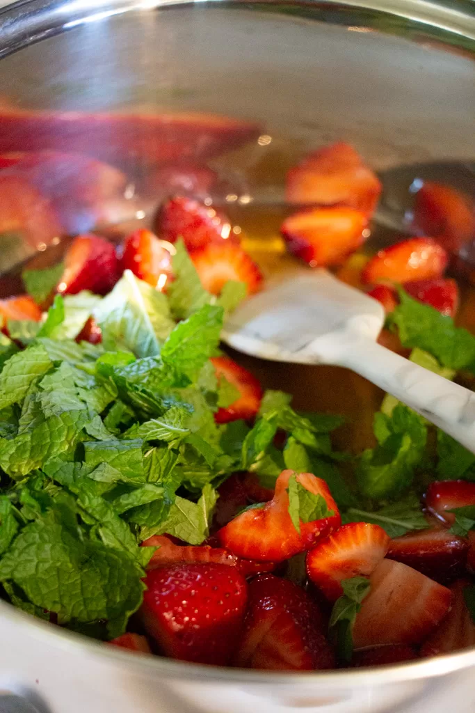 all strawberry mint syrup ingredients in pot