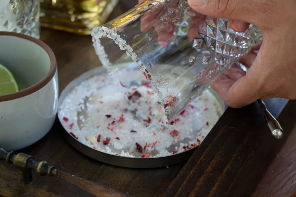 rimming clear cut glass with strawberry salt