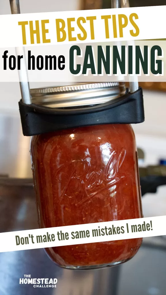 canning tips pin with jar lifter holding jar
