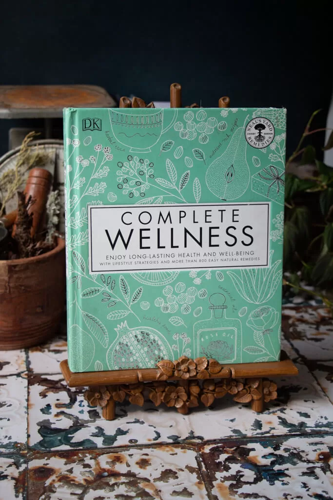 complete wellness- book with a teal green cover