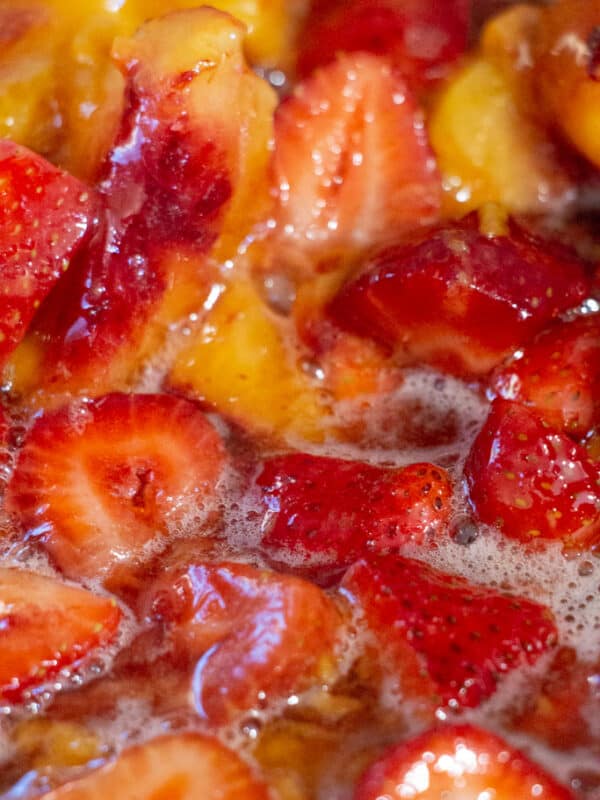 simmering strawberries and peaches up close