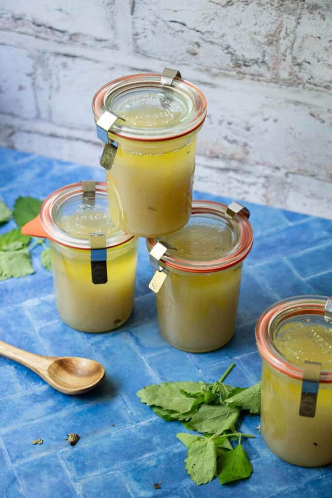 4 small weck jars of pale yellow sugar scrub with lemon balm