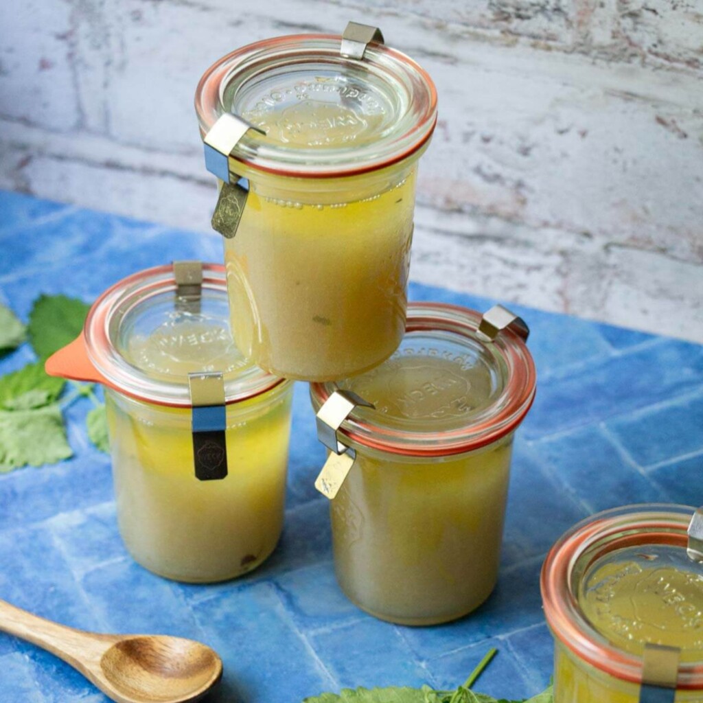 4 small weck jars of pale yellow sugar scrub with lemon balm
