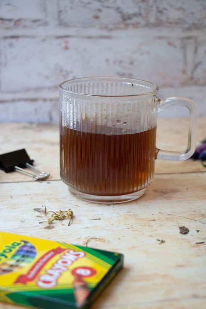 back to school stress tea on table next to various school supplies