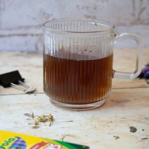 back to school stress tea on table next to various school supplies