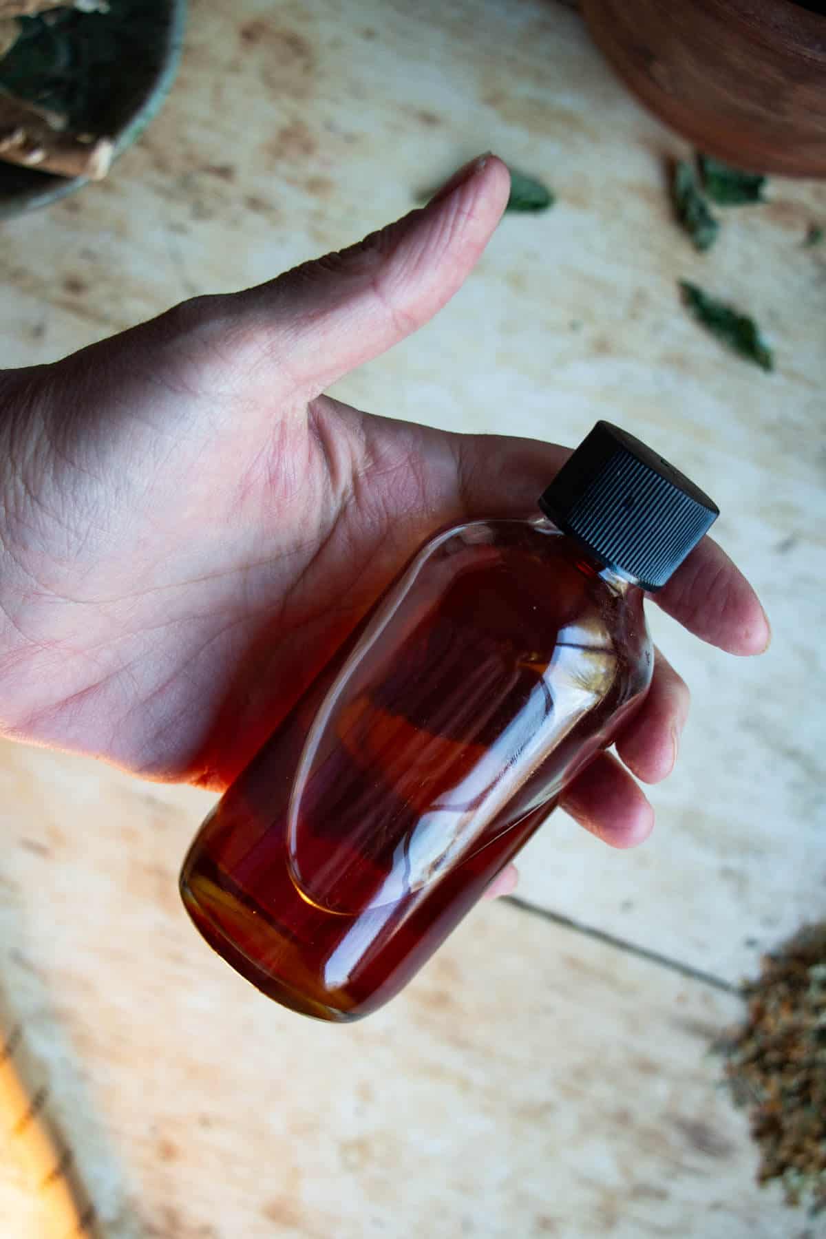 hand holding st johns wort oil